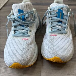 Brooks Launch 11 White Athletic Sneakers with Blue Laces and Yellow Toe Accents